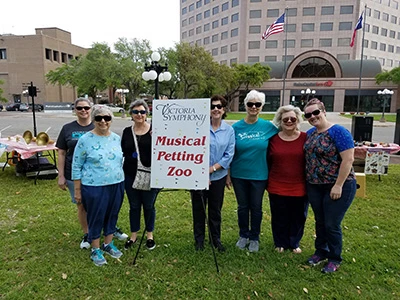 Group of women at a "Musical Petting Zoo" event.